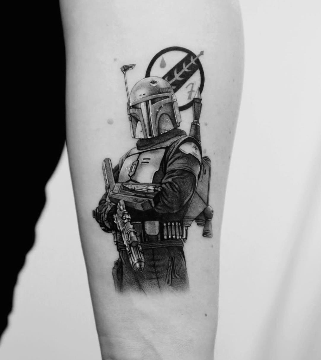 An armoured Star Wars bounty hunter in front of a round emblem.