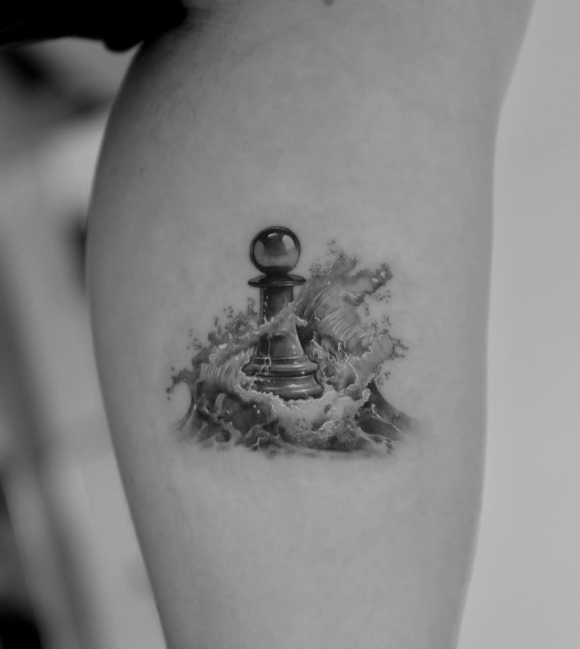 A chess pawn standing in a crashing wave.
